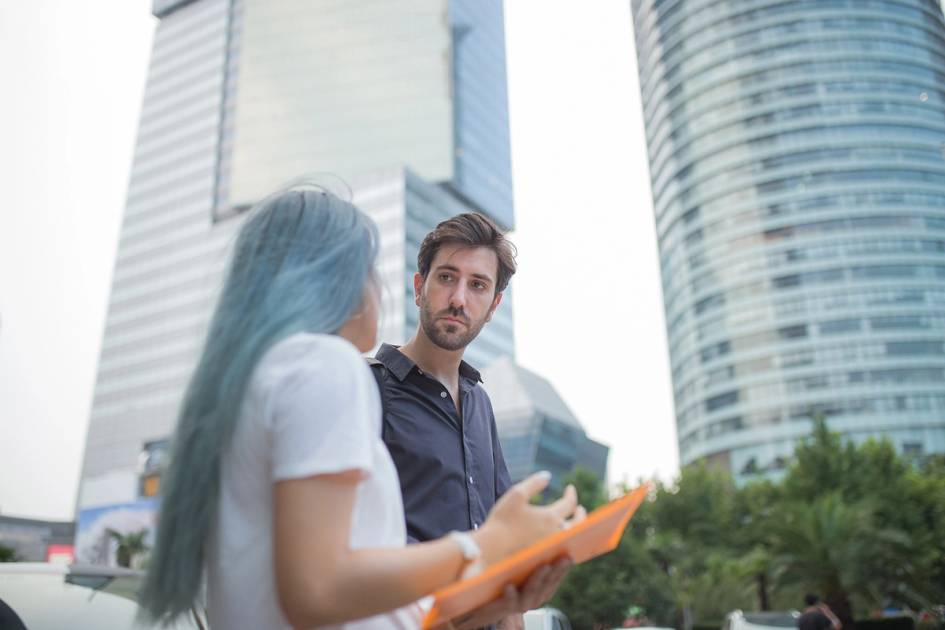 Two urban planners discuss a project.