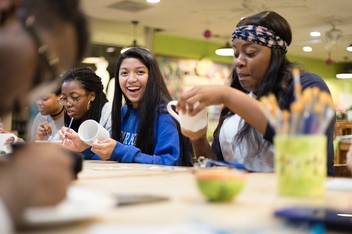 EMBARK students get to know each other while painting pottery at All Fired Up.