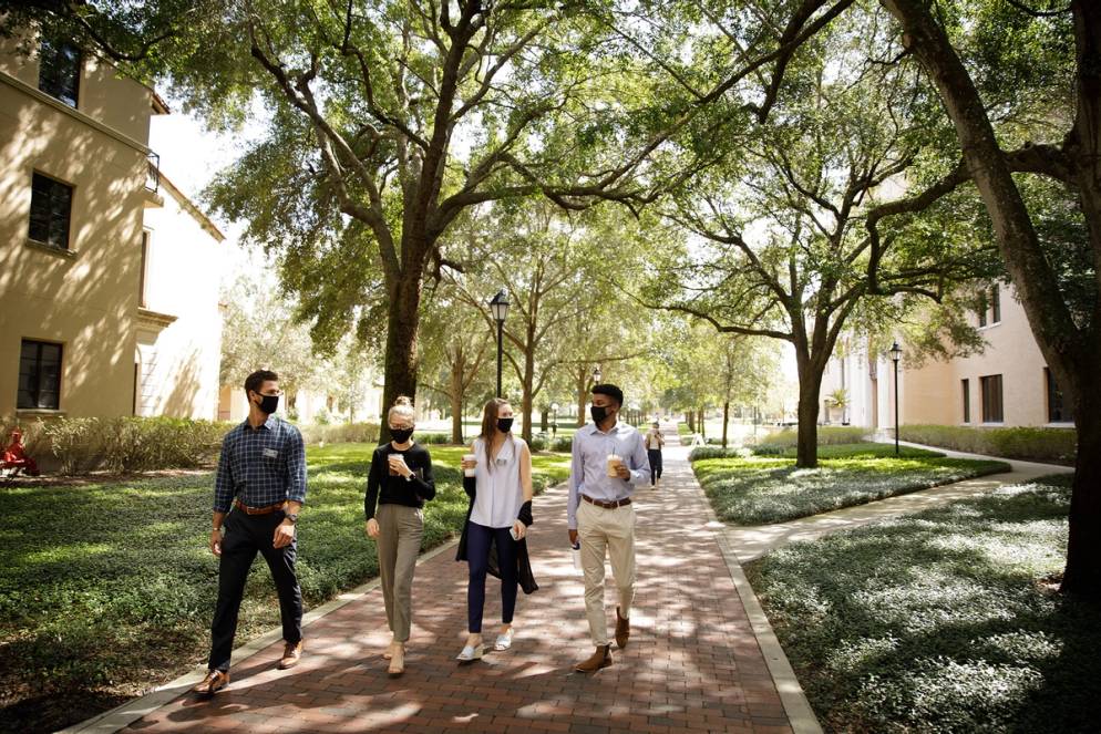 Crummer Graduate of Business School students walking on campus.