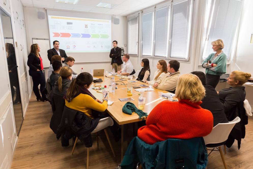 Rollins students sit in on a boardroom meeting on a business-focused field study to France.