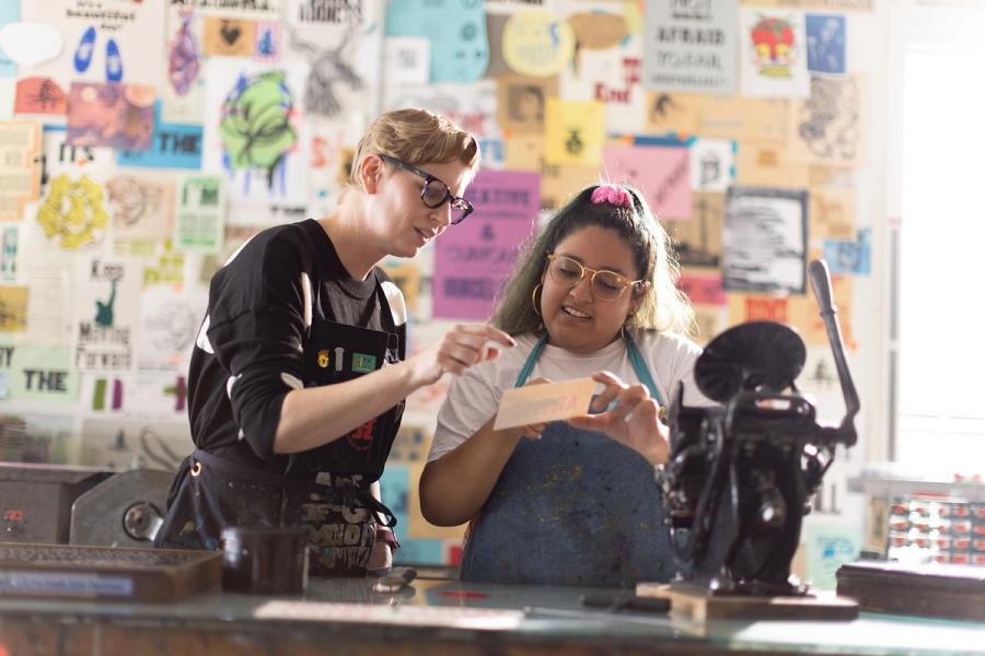 Art professor and student working in the screen-printing studio. 