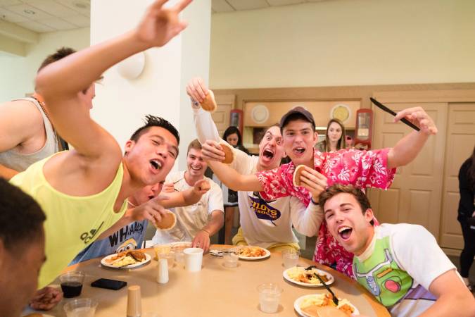 Students eating pancake breakfast before kicking off Fox Day festivities.