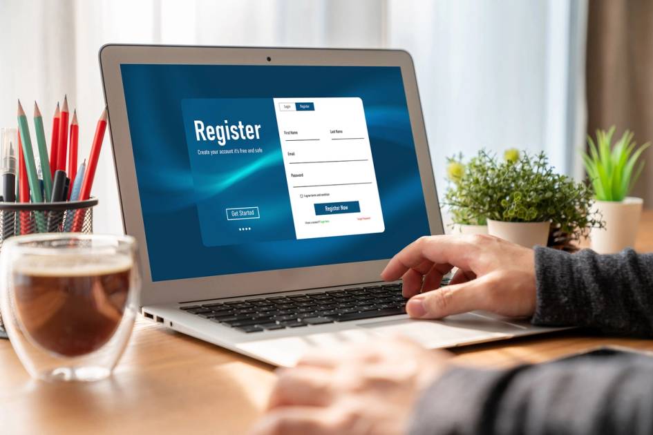 A prospective student registers for a course on a laptop.