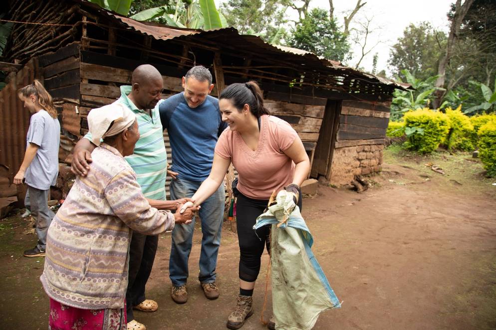 Students meet with local villagers in Tanzania on a field study focused on community development.