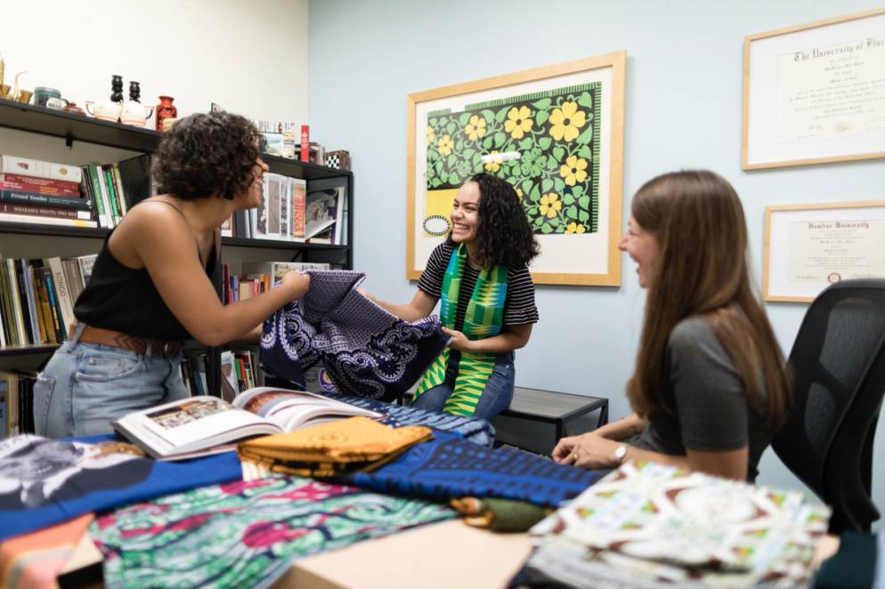 Students collaborate on textile research in the Cornell Fine Arts Museum.