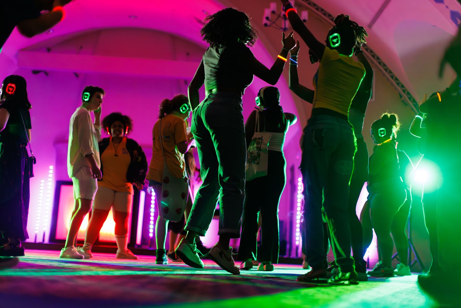 Students dance during glow-in-the-dark disco night at orientation.