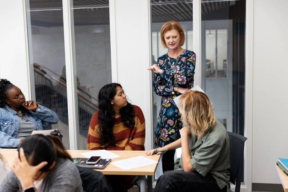 A professors works with a small group of ABA master's program students.