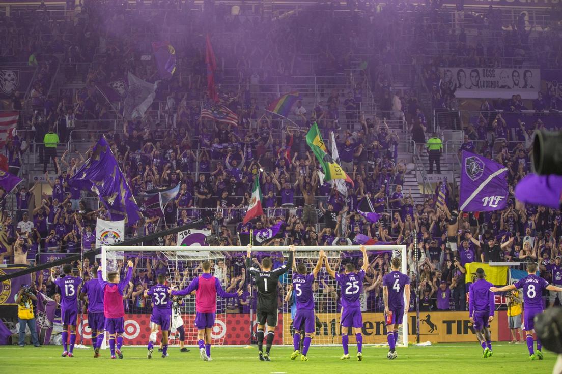 The Orlando City Soccer team celebrates a win.