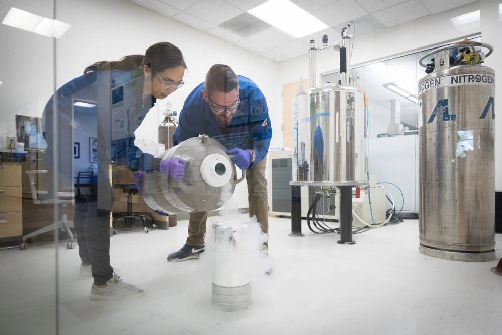 Chemistry professor Ellane Park and her student using liquid nitrogen for an experiment in the chemistry lab.