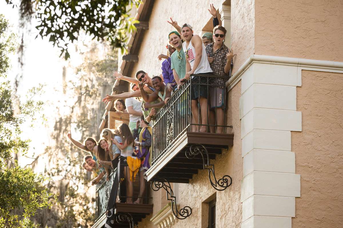 Students on a dorm balcony getting ready to celebrate Fox Day.