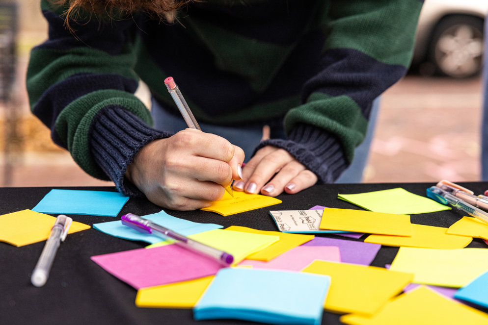 Student writing a thank you note