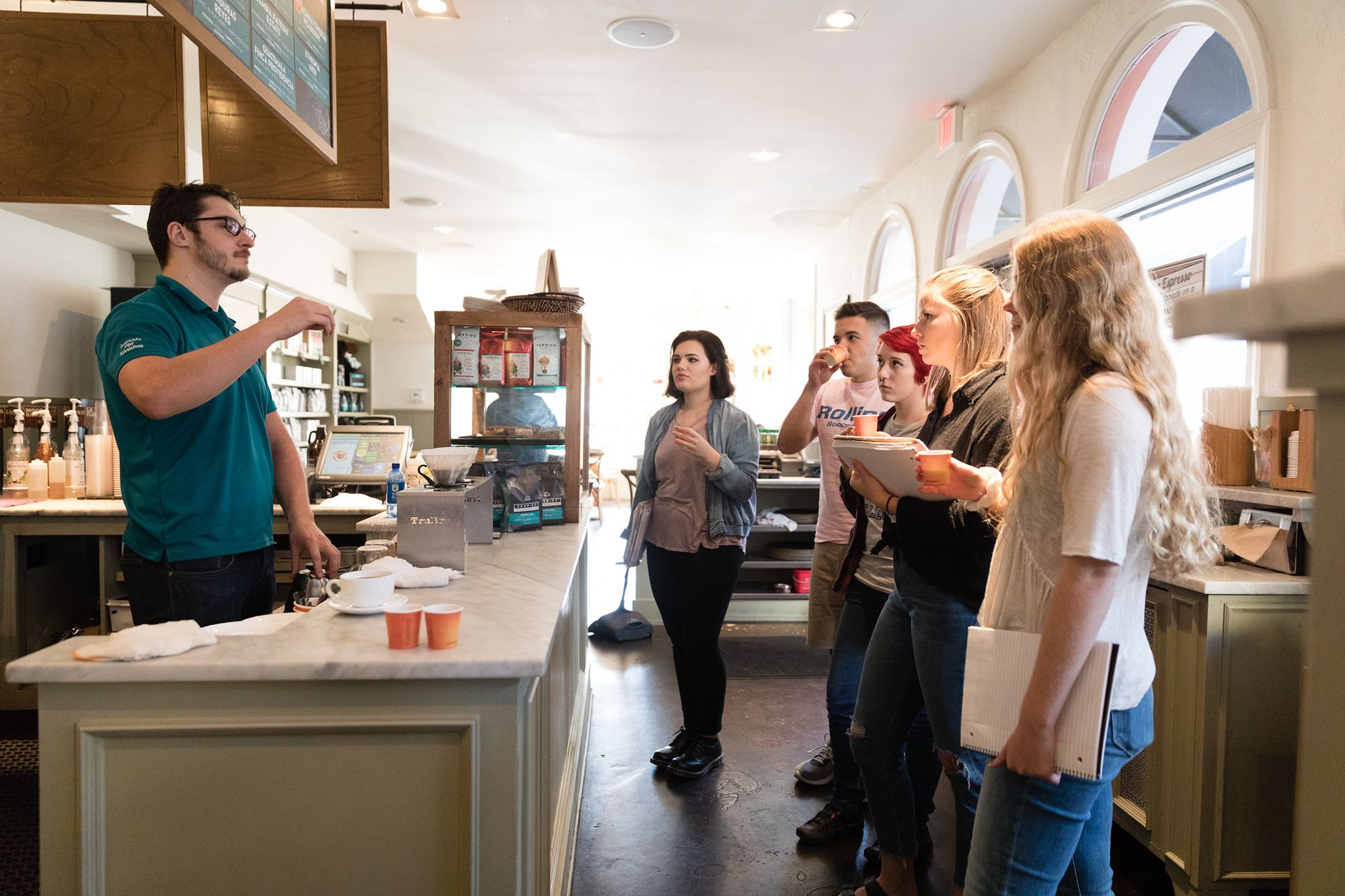 Students sample different brews from the supervisor of coffee at Barnie’s CoffeeKitchen on Park Avenue.