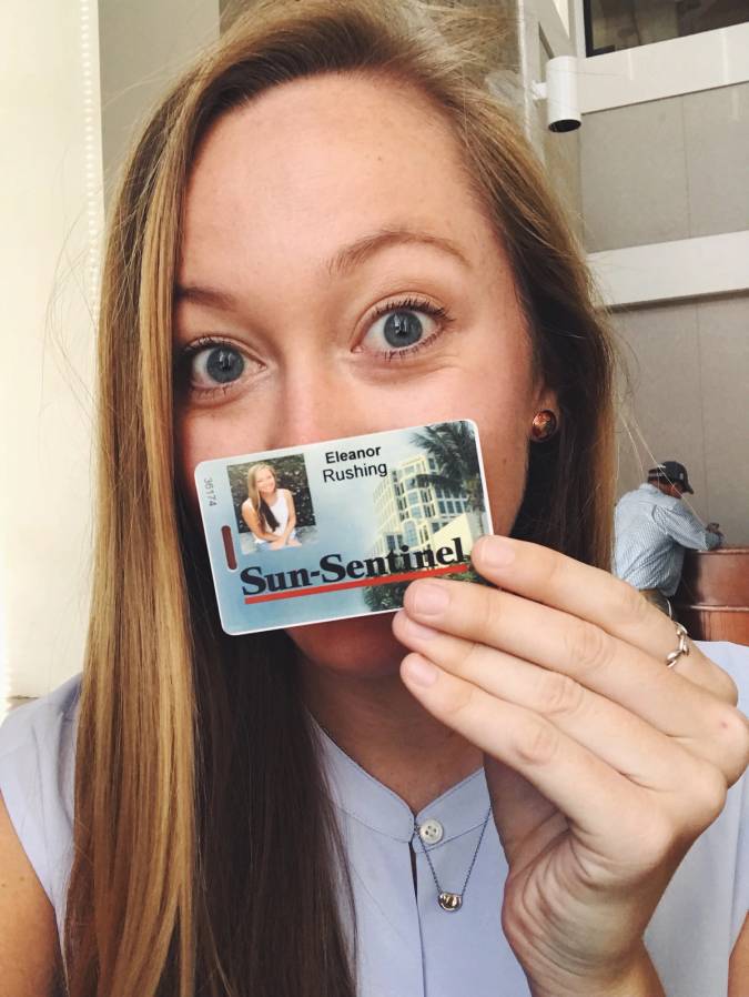 Ellie Rushing poses with her press badge as an intern for the South Florida Sun Sentinel.