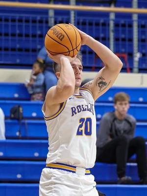 Rivers Lenholt shooting a basketball during a game.