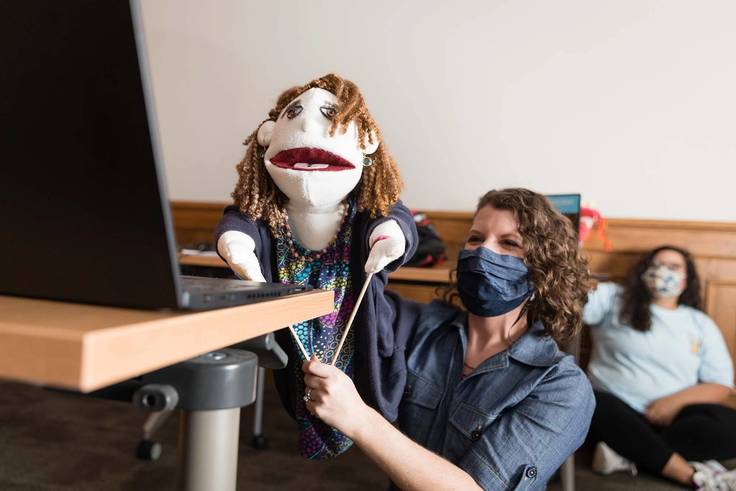 Instructor Sarah Parsloe poses with a puppet
