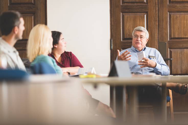 Philosophy professor Tom Cook engages students in class discussion.
