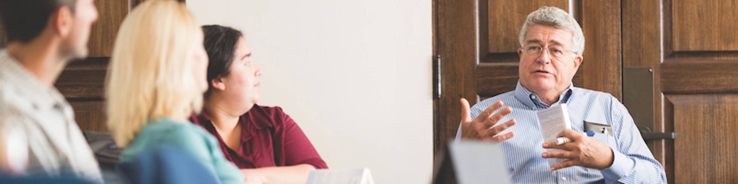 A professor leads a classroom discussion.