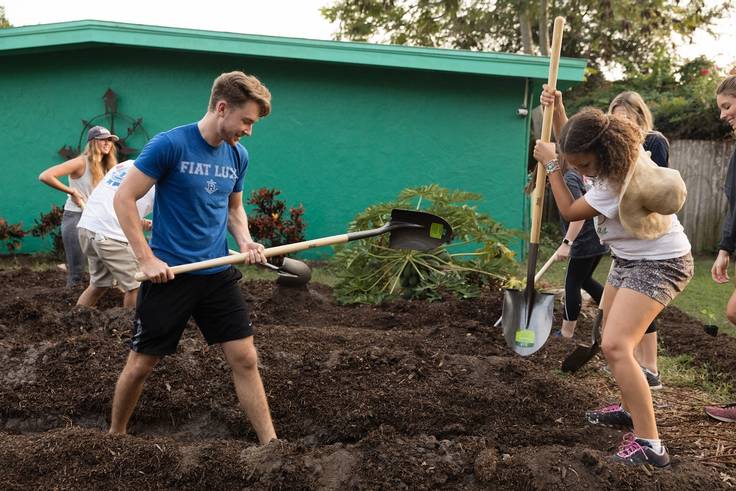 A group of students prepares a residential urban farm.