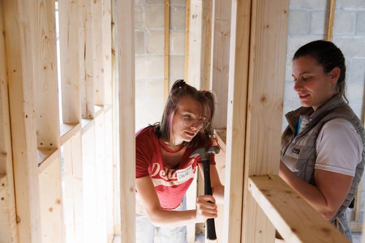 Students help build a home with Habitat for Humanity.