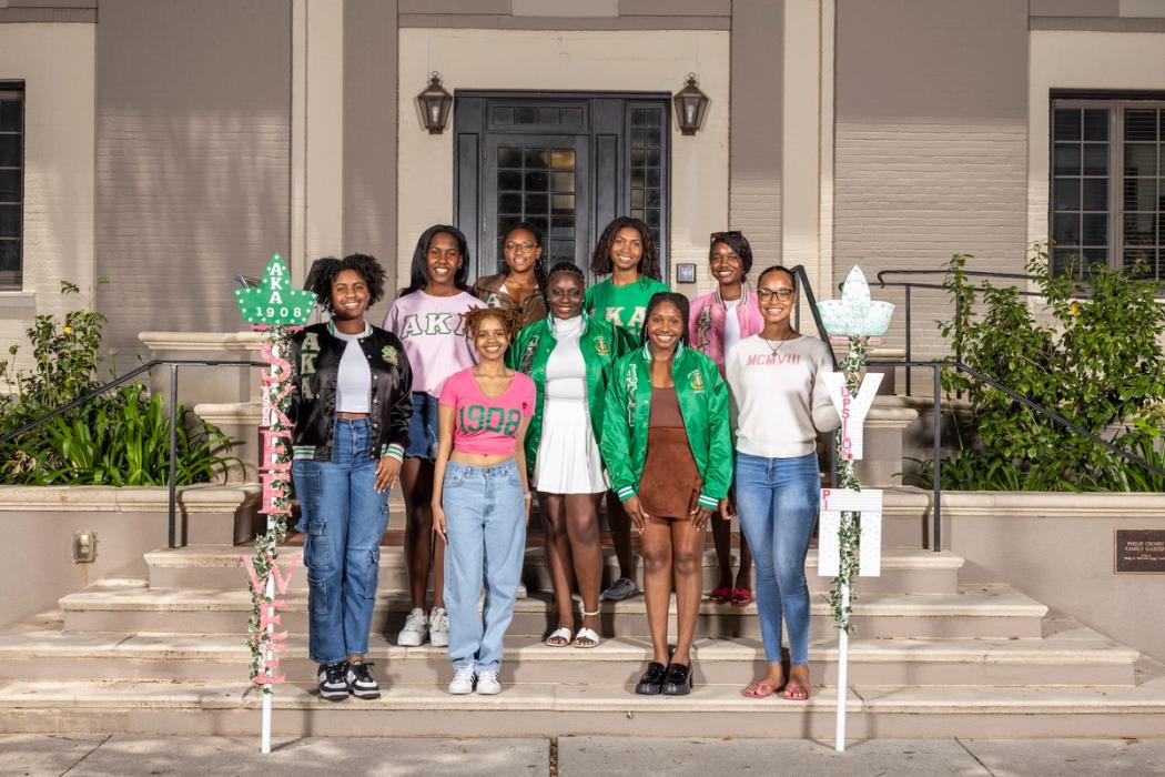 Alpha Kappa Alpha Sorority chartering event, where sisters perform a step routine.