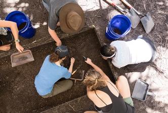 A professor and students excavate a dig site near Rollins’ campus.