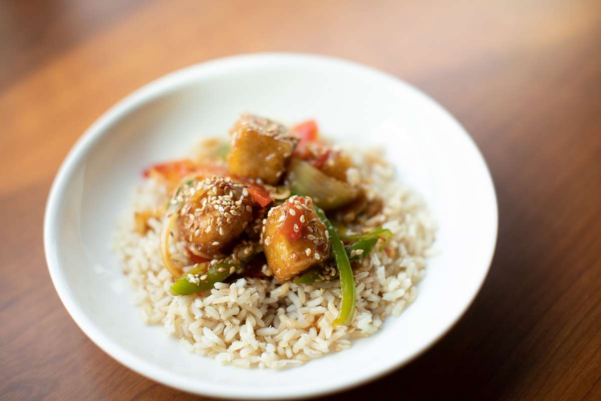 Buffalo-style tofu served with veggies and brown rice.
