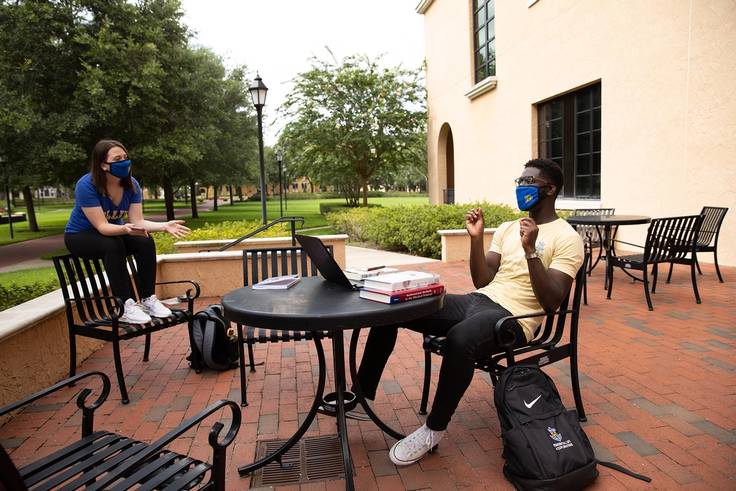 Students studying on the Bush Science Center patio.