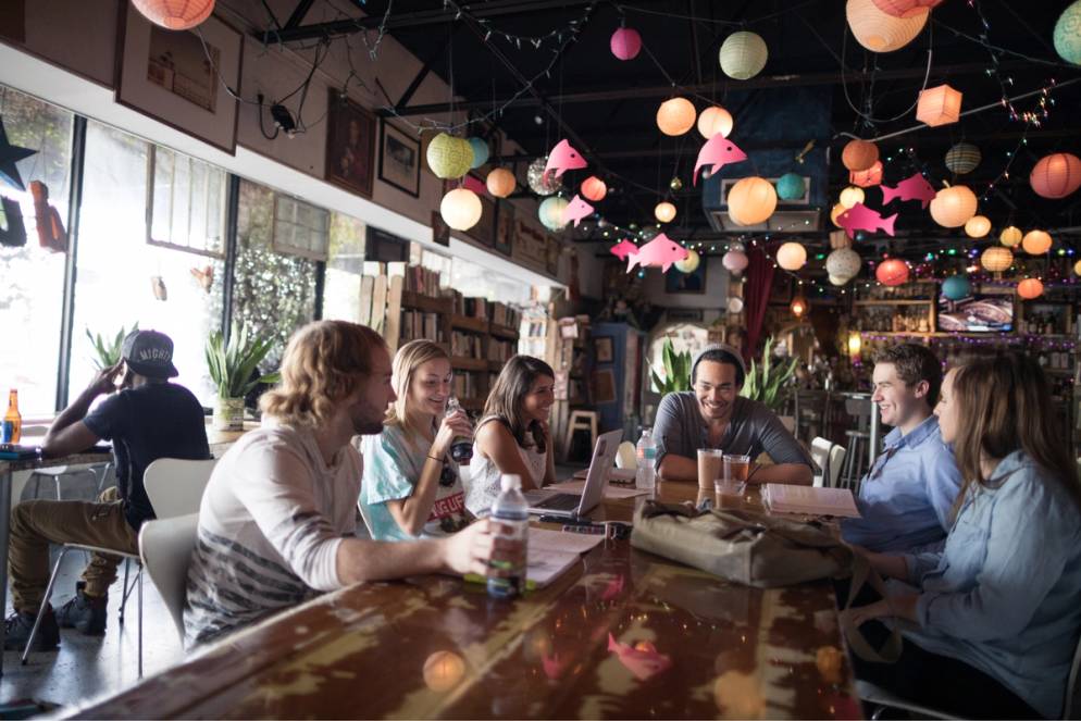 Students sit around a table at Stardust.