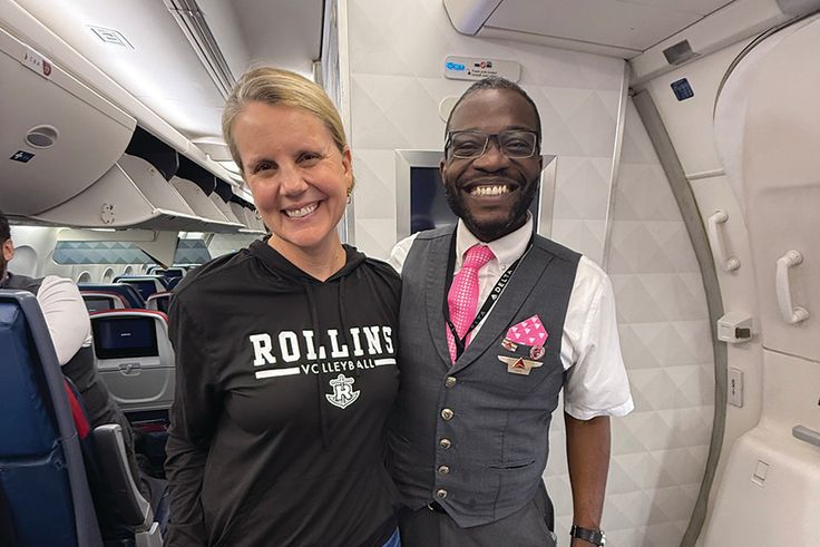 President Brooke Barnett wearing Rollins gear on a flight