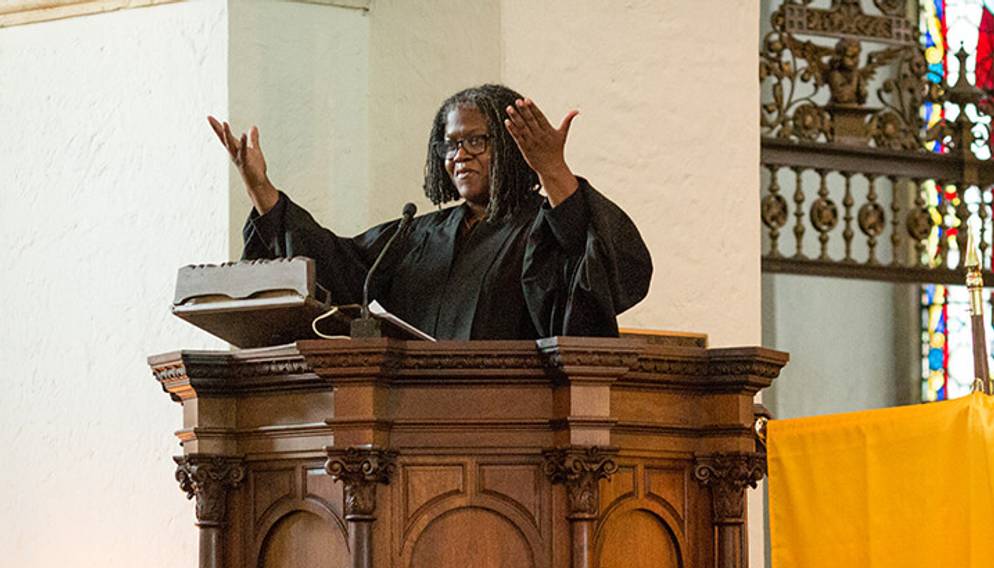 Rev. Katrina Jenkins speaking from the pulpit in Knowles Memorial Chapel.