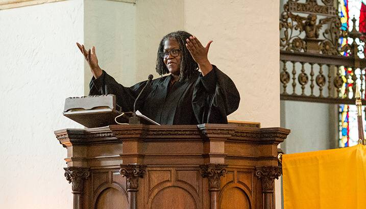 Rev. Katrina Jenkins speaking from the pulpit in Knowles Memorial Chapel.