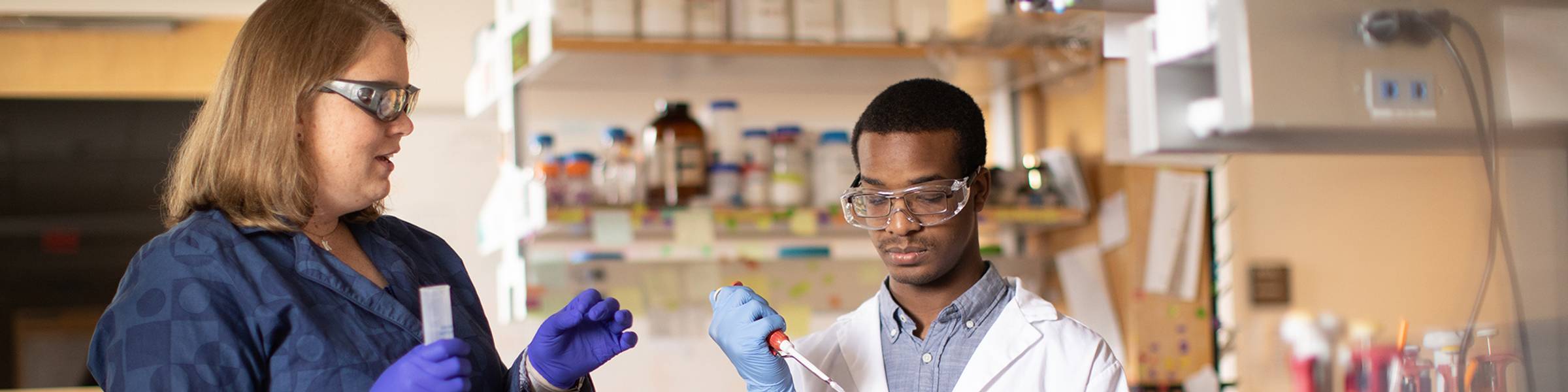 A chemistry professor and a student conduct research in a lab at Rollins College.