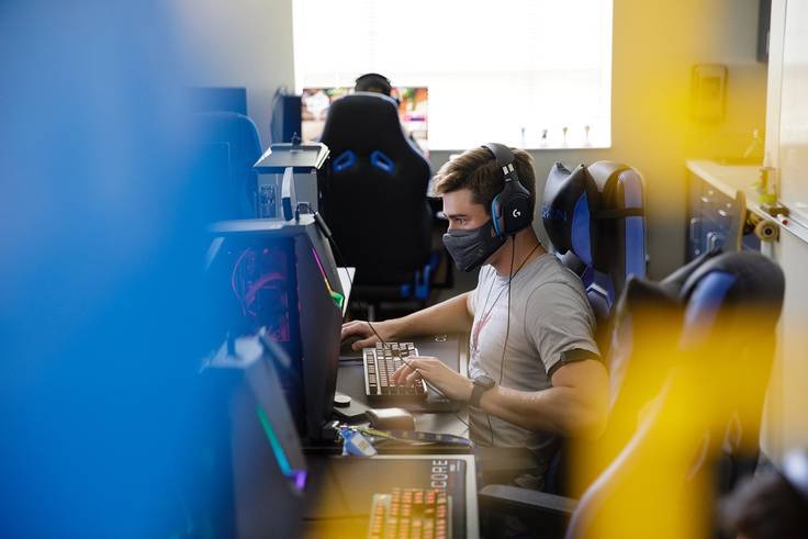 A mass student plays a game in the Rollins esports studio