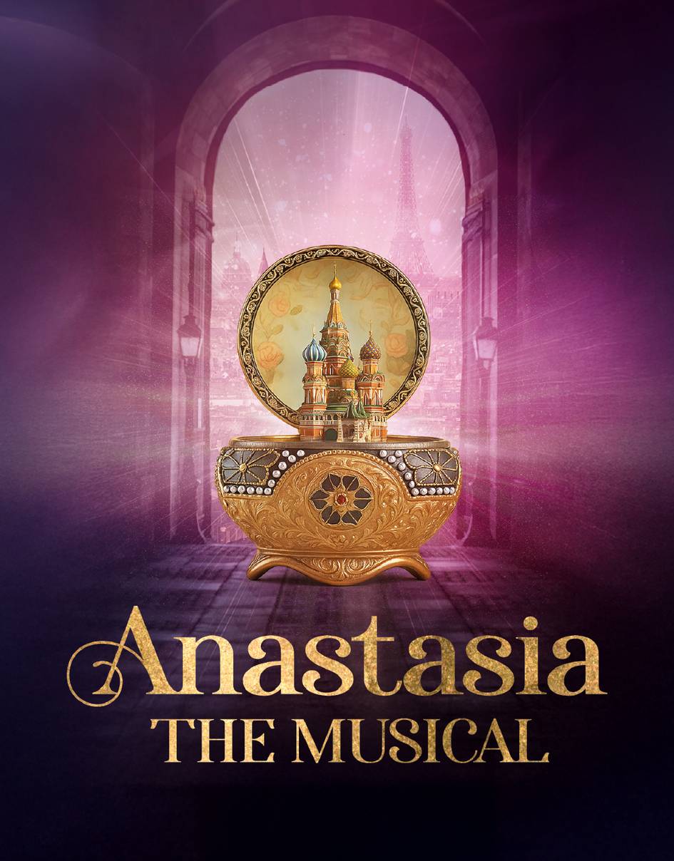 A colorful antique music box contains a Russian castle. Behind it in a faint purple, a window overlooks the Paris skyline