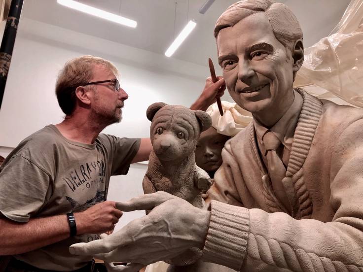 Artist Paul Day working on the sculpture of Mister Rogers for Rollins College.