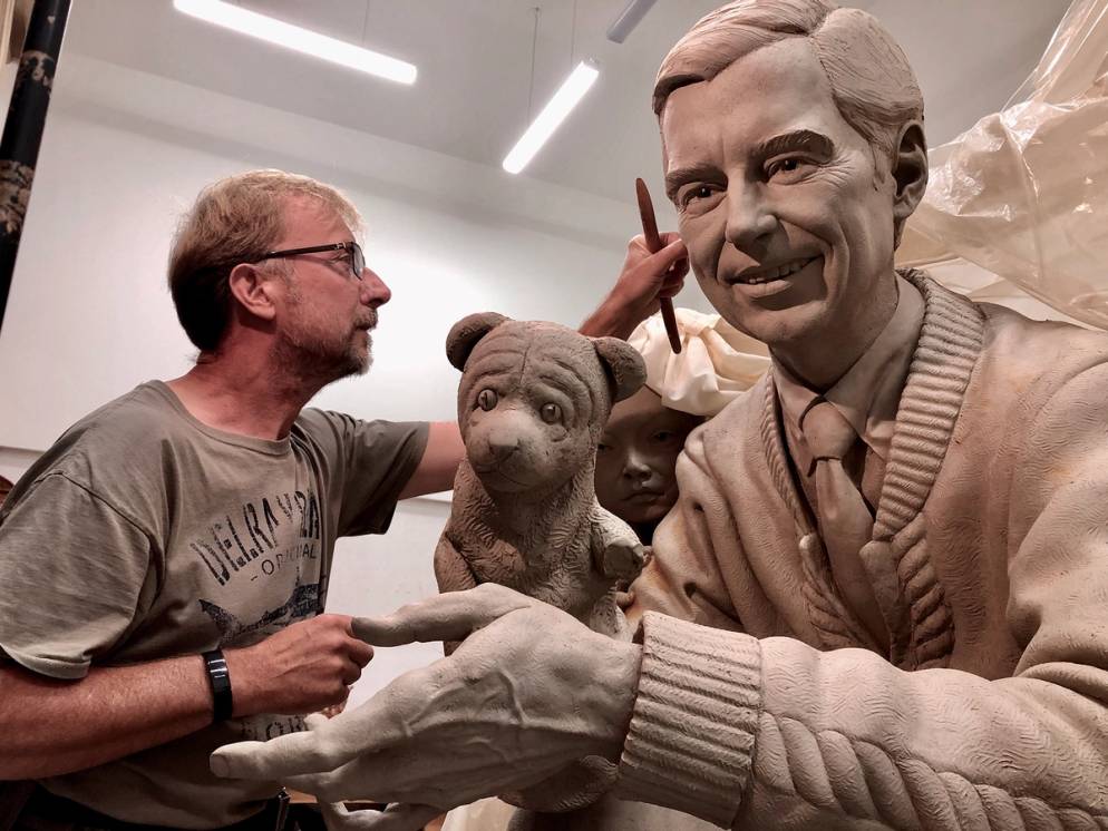 Artist Paul Day working on the sculpture of Mister Rogers for Rollins College.