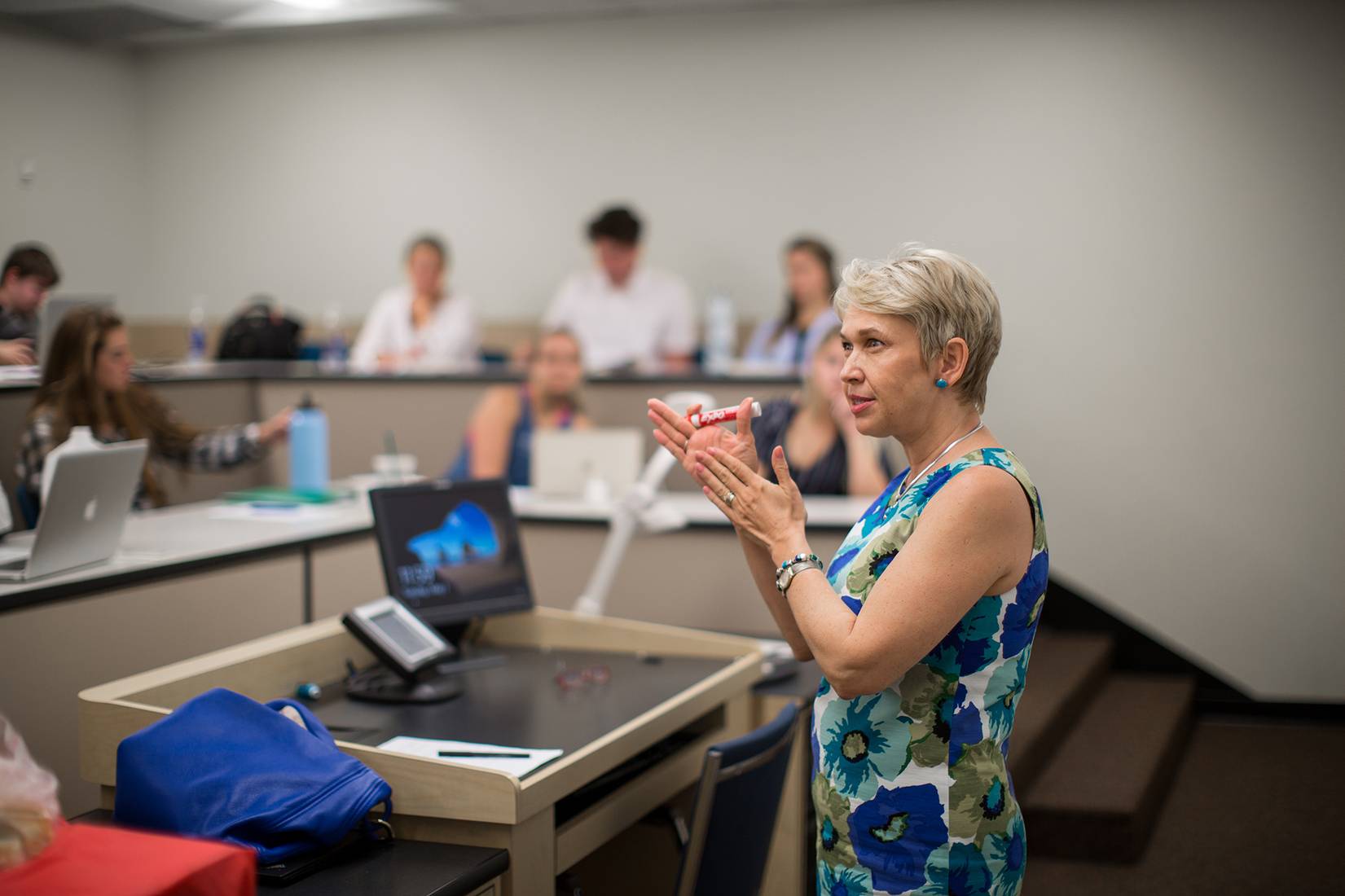 Economics professor Anca Voicu giving a lesson on European economies.