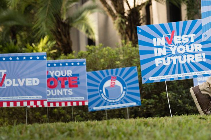 Signs on campus encouraging civic participation in the democratic process