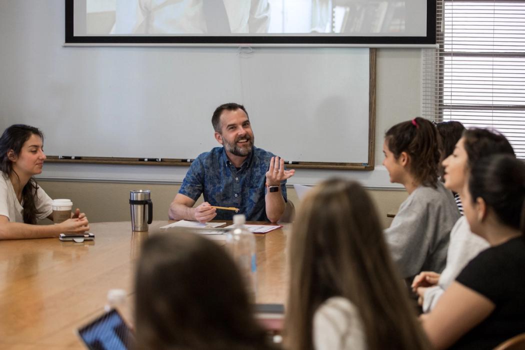 Rollins English professor and students having a class discussion.