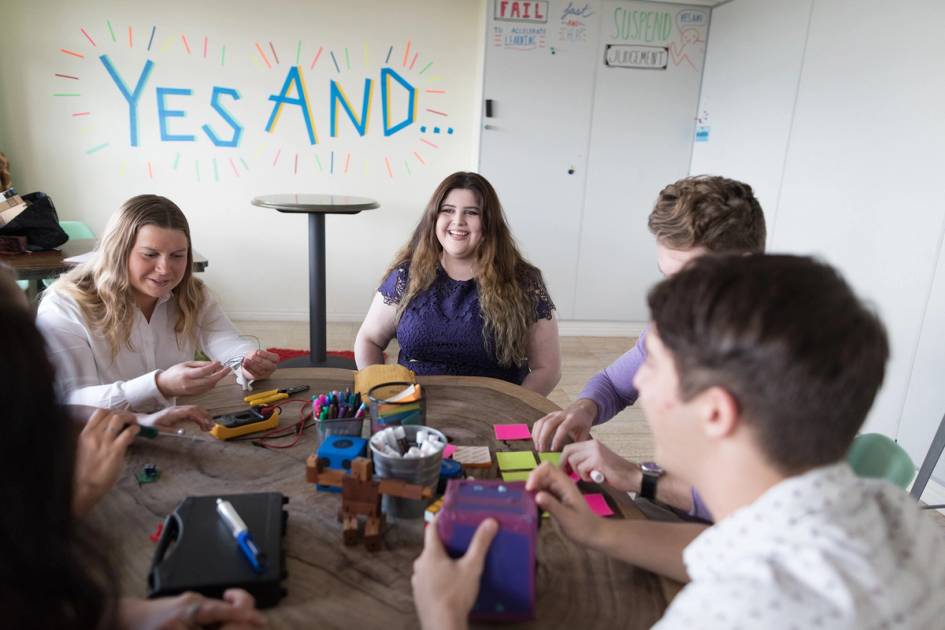 A student smiles during a brainstorming exercise.