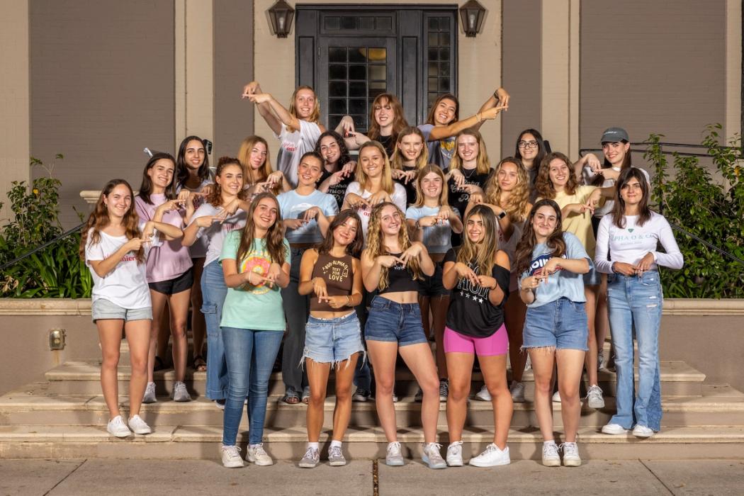 Alpha Omicron Pi Sorority sisters together near Lake Virginia on Rollins campus.