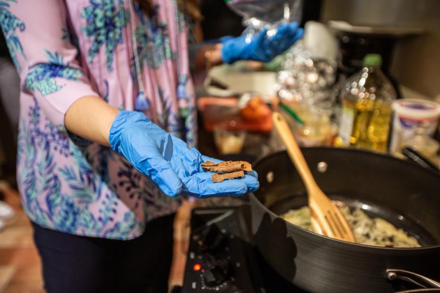 A Pakistani chef shows some of the spices she uses during a cooking demonstration.