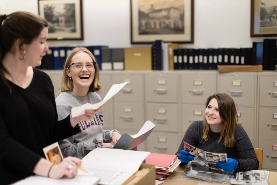 Rollins students researching American history in the Olin library.