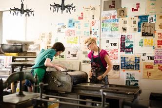 Studio art majors in a printmaking studio.