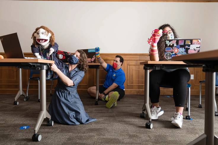 Student and professors use the puppets they created as communication tools to help grieving children.