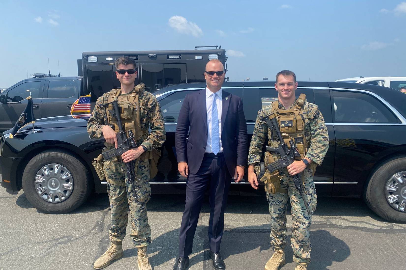 Davis posing with military personnel