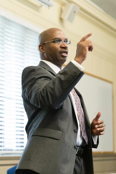 A philosophy professor leads a class discussion.