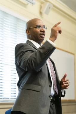 A philosophy professor leads a class discussion.