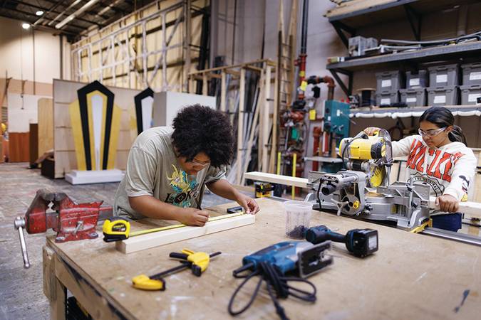 Theatre students woodworking