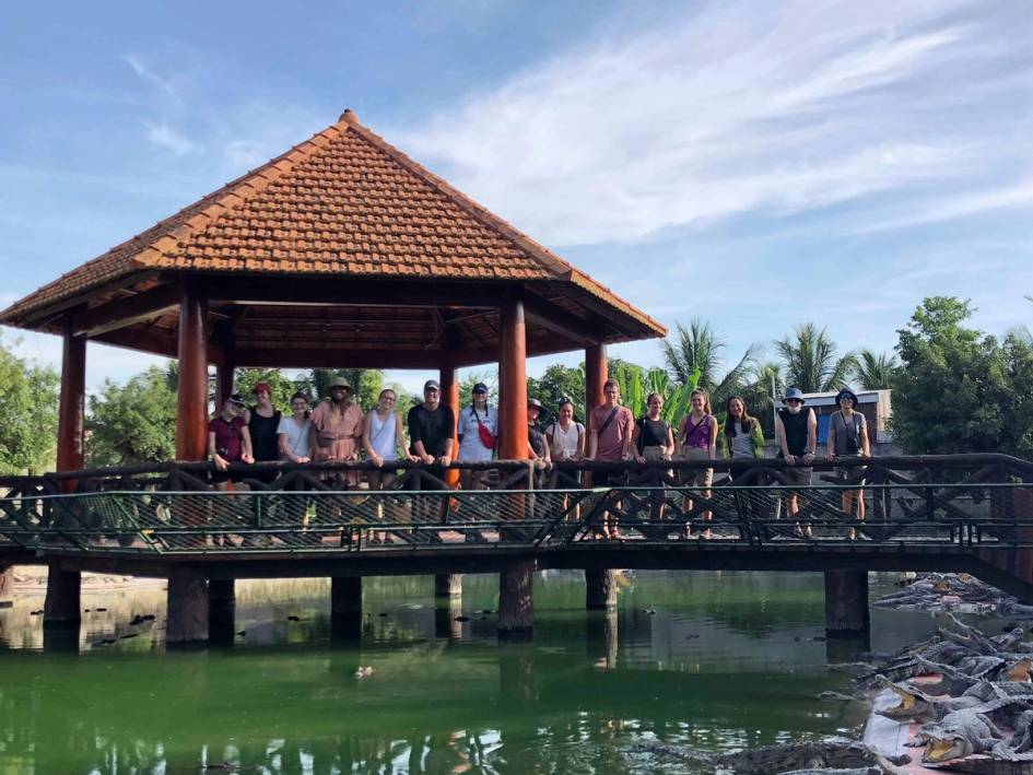 Students pose for a picture during a field study in Vietnam.